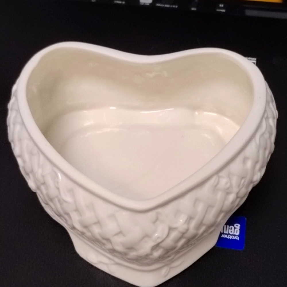 White glass heart bowl with basket design on outside